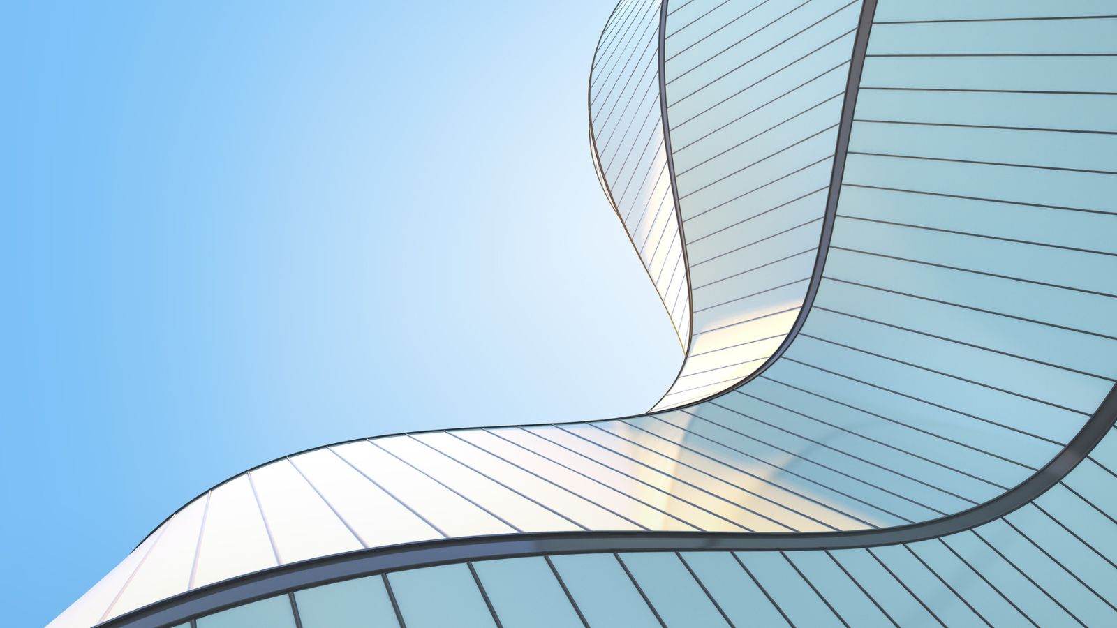 Low angle view of modern office skyscrapers representing the foundational investment required for enterprise artificial intelligence