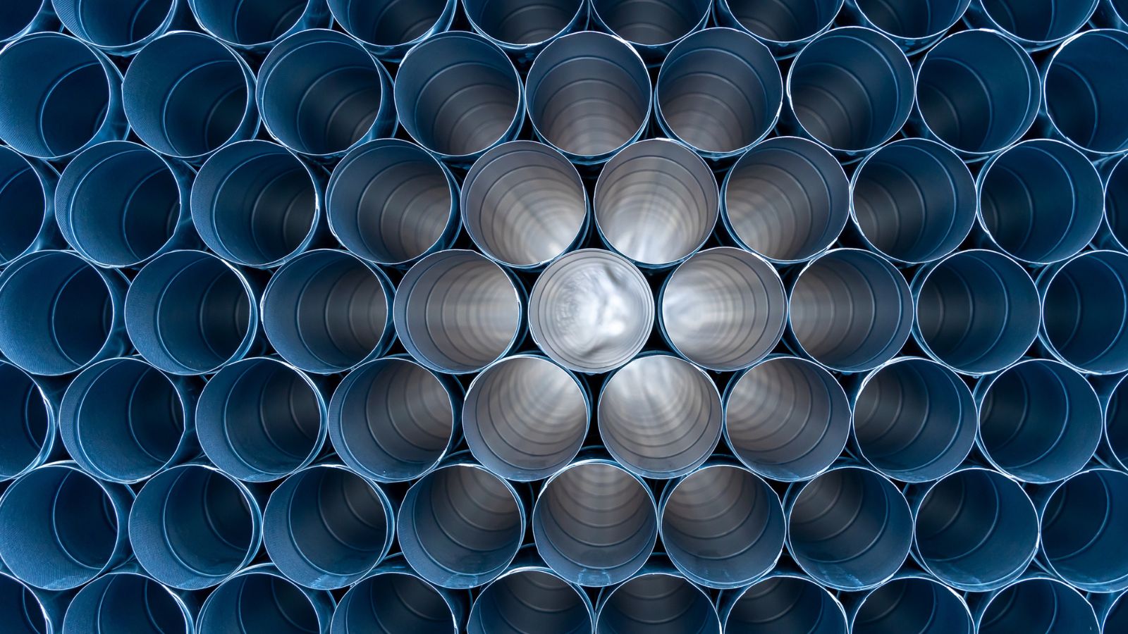 Stacked industrial pipes illustrate the repeatable architectural framework required for reliable enterprise data pipelines